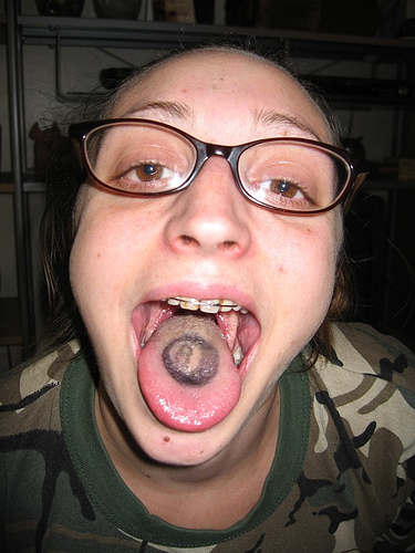 Black Eightball Tattoo On Tongue