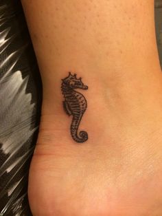 Black Ink Little Seahorse Tattoo On Ankle