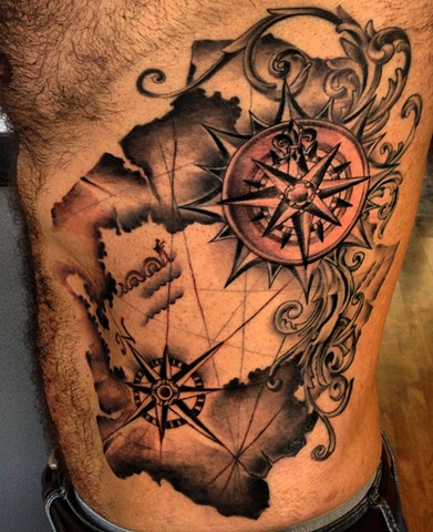 Black Ink Map With Two Compass Tattoo On Man Side Rib