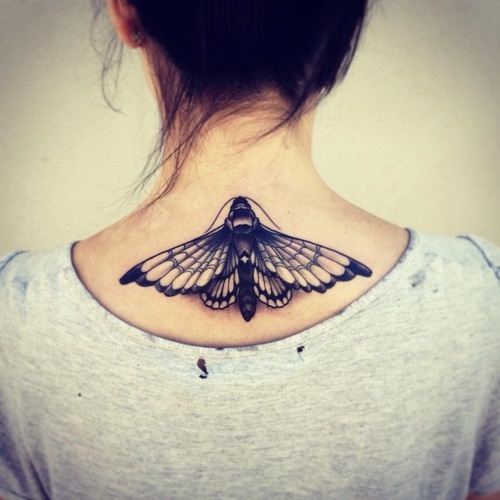 Black Ink Moth Tattoo On Girl Upper Back