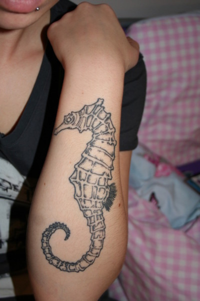 Black Ink Seahorse Tattoo On Left Forearm