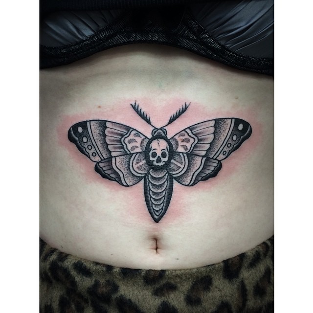 Black Ink Skull In Moth Tattoo On Stomach