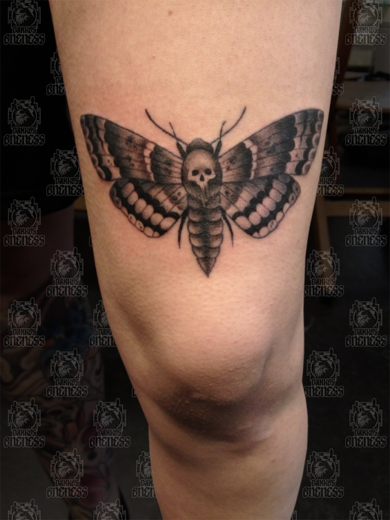 Black Ink Skull In Moth Tattoo On Thigh