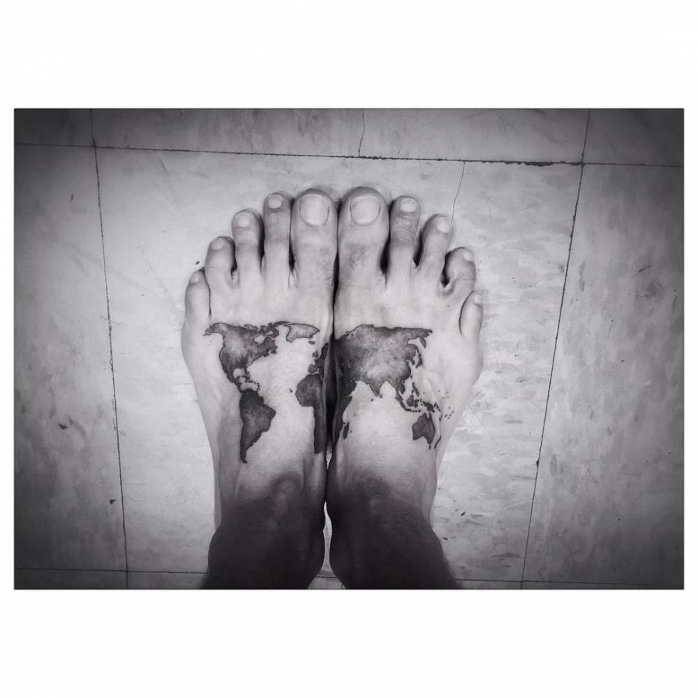 Black Ink World Map Tattoo On Feet