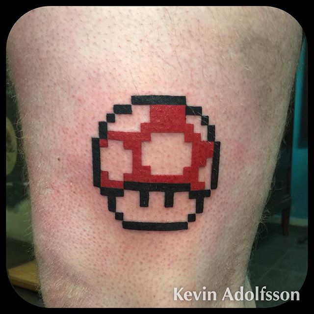 Black Outline Red Mario Mushroom Tattoo by Kevin Adolfsson