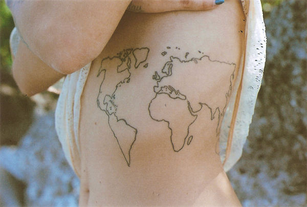 Black Outline World Map Tattoo On Girl Side Rib