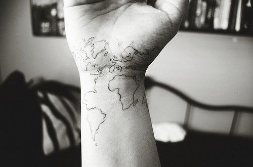 Black Outline World Map Tattoo On Wrist