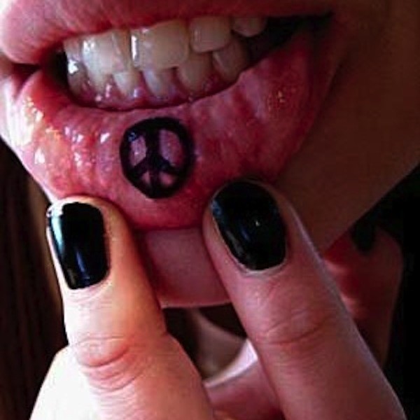 Black Peace Logo Tattoo On Inner Lip