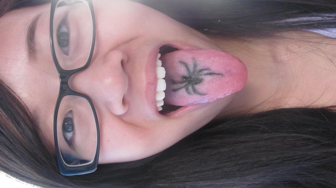 Black Spider Tattoo On Girl Tongue