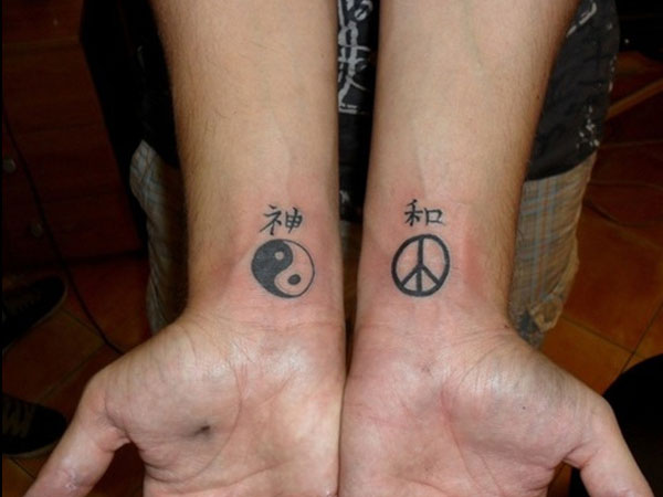Black Yin Yang And Peace Logo Tattoo On Both Wrist
