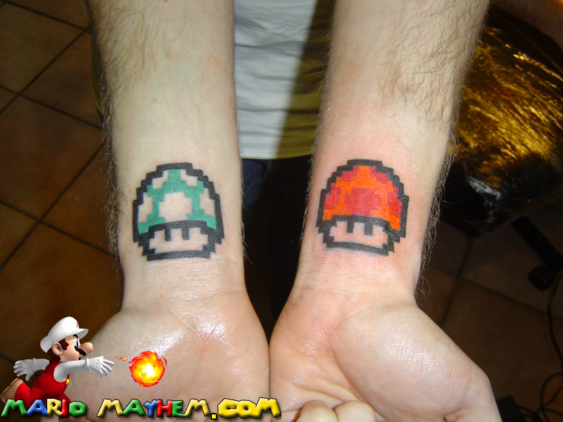 Blue And Orange Mario Mushroom Tattoos On Wrists