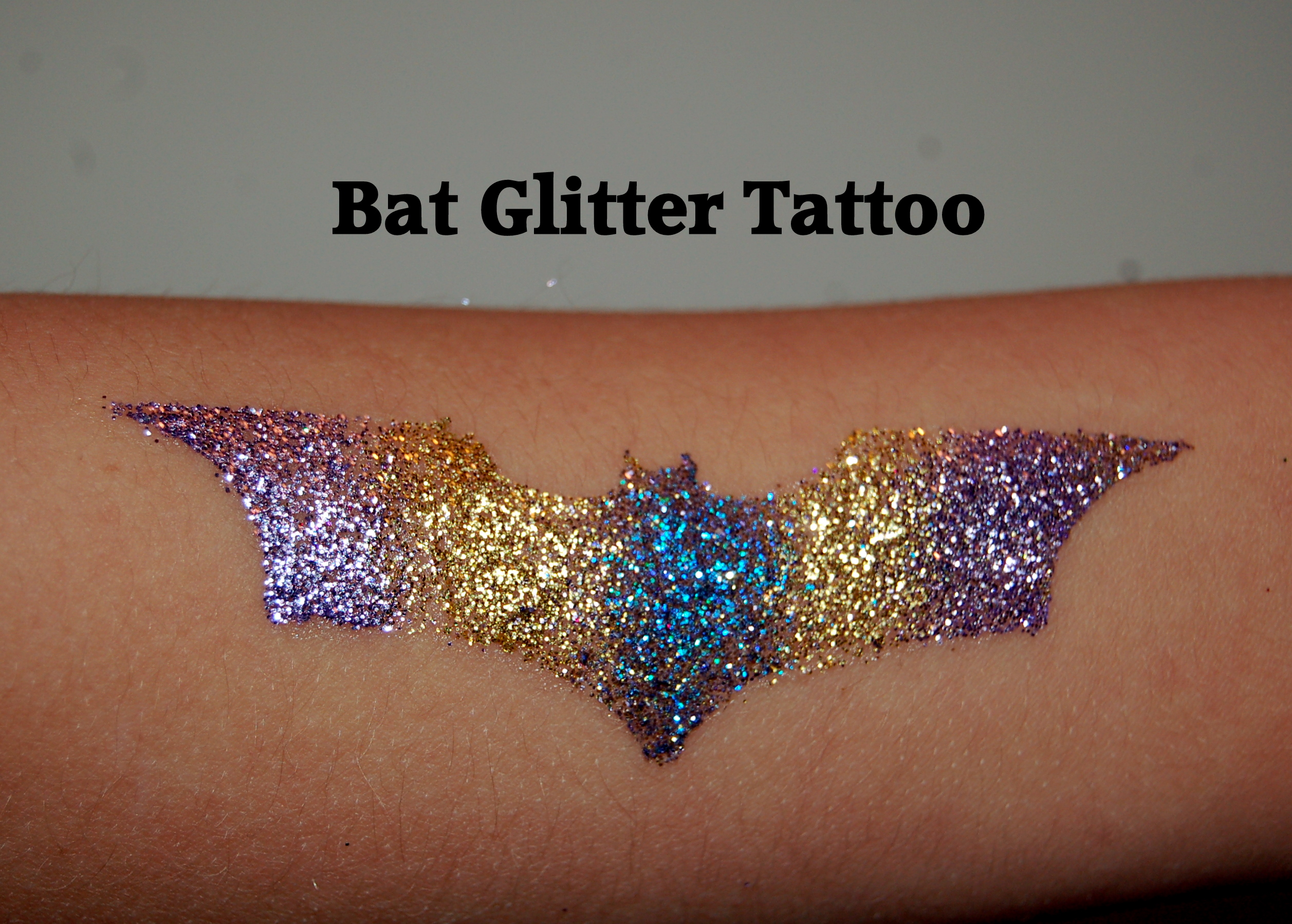 Colorful Glitter Bat Tattoo Design For Forearm