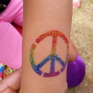 Colorful Glitter Peace Logo Tattoo Design For Arm