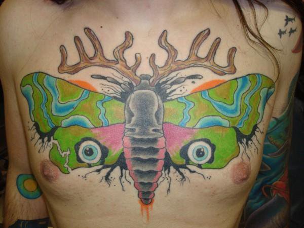 Colorful Moth Chest Tattoo by NateOsborne