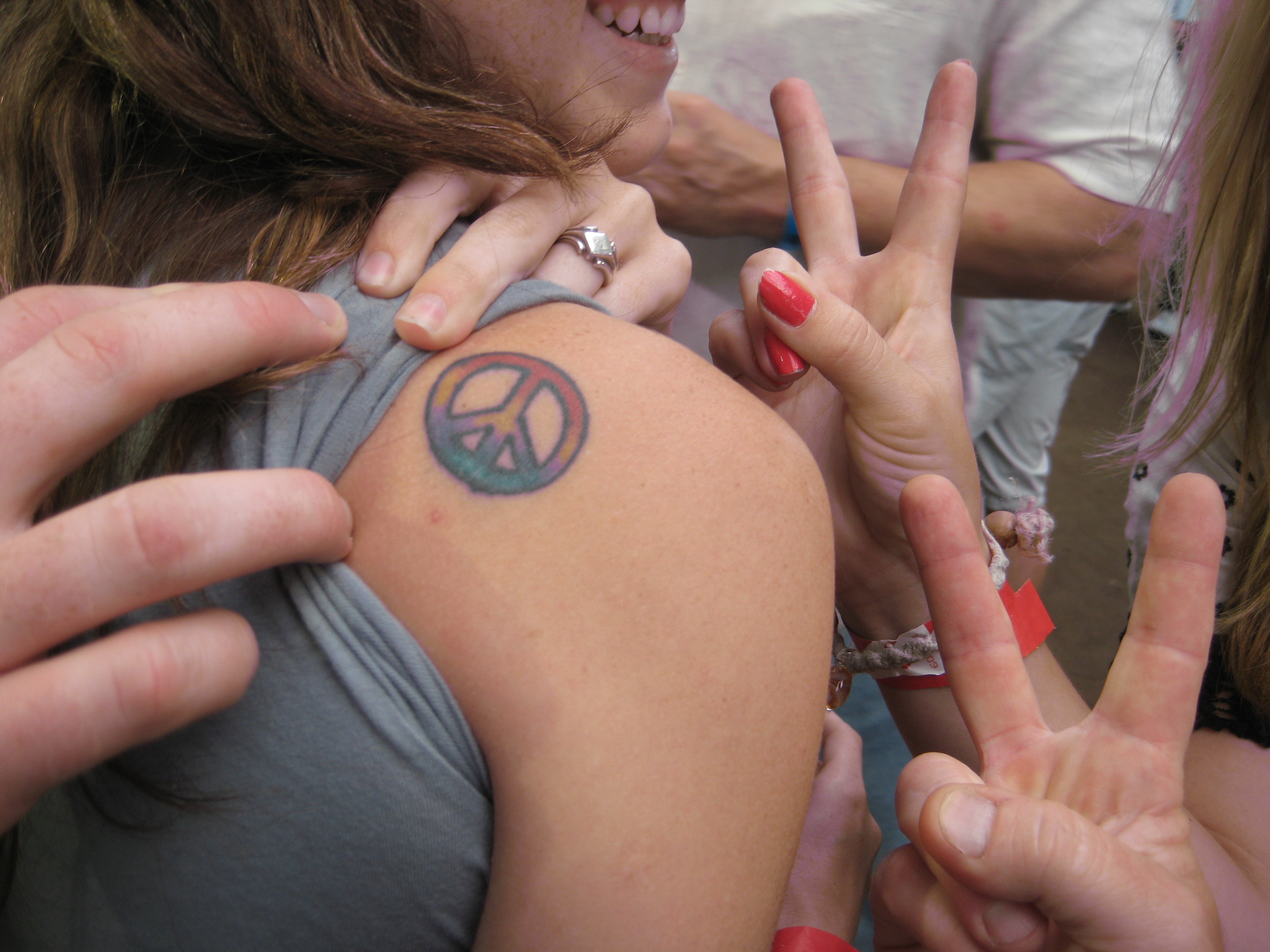 Colorful Peace Logo Tattoo On Girl Right Back Shoulder