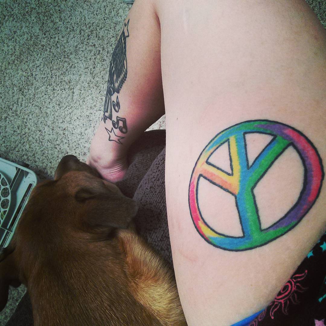 Colorful Peace Logo Tattoo On Girl Side Thigh