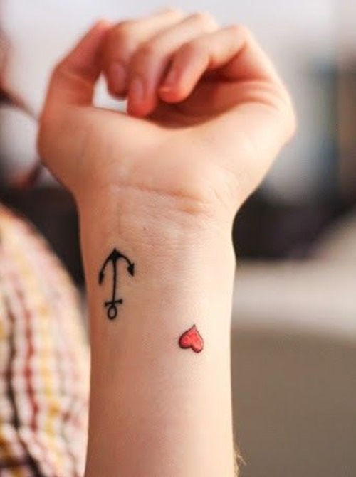 Cute Heart And Anchor Wrist Tattoo For Women