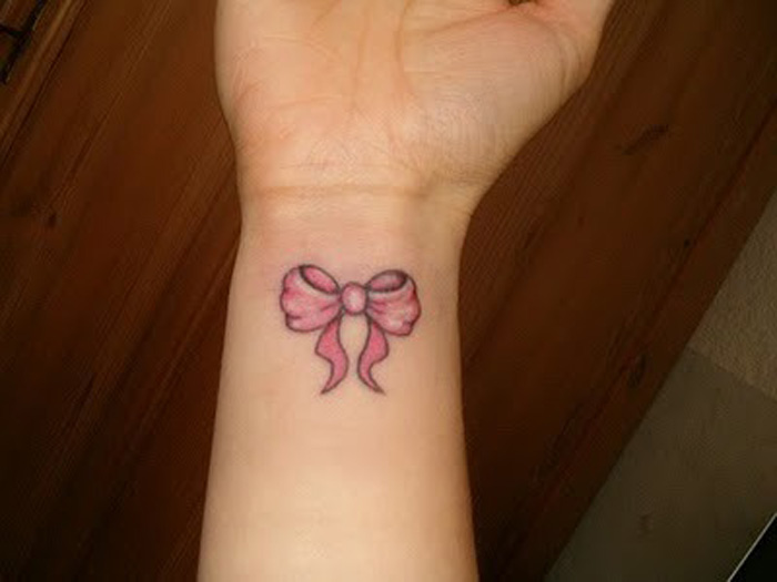 Cute Pink Bow Wrist Tattoo For Women