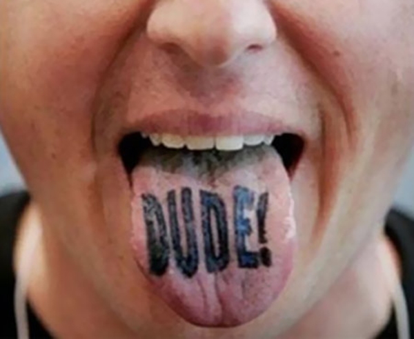 Dude Lettering Tattoo On Tongue
