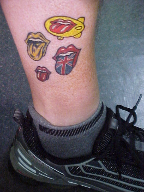 Four Colorful Tongue Tattoo On Leg