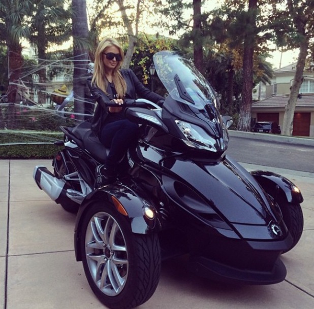 Funny Paris Hilton On Black Spider Bike