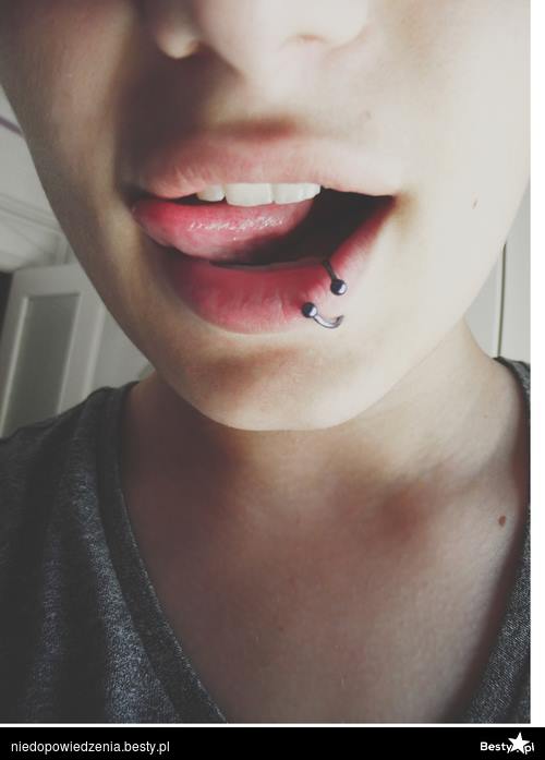 Girl Have Lip Piercing With Spiral Stud