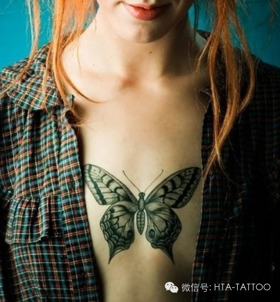 Girl Have Moth Chest Tattoo