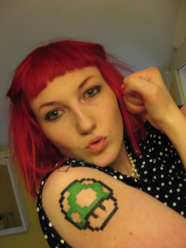 Girl Showing Her Mario Mushroom Tattoo