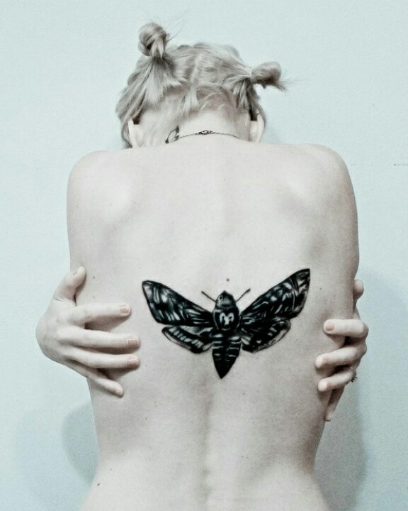 Girl Showing Her Realistic Moth Tattoo On Full Back