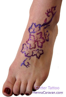 Glitter Flowers Tattoo On Girl Foot