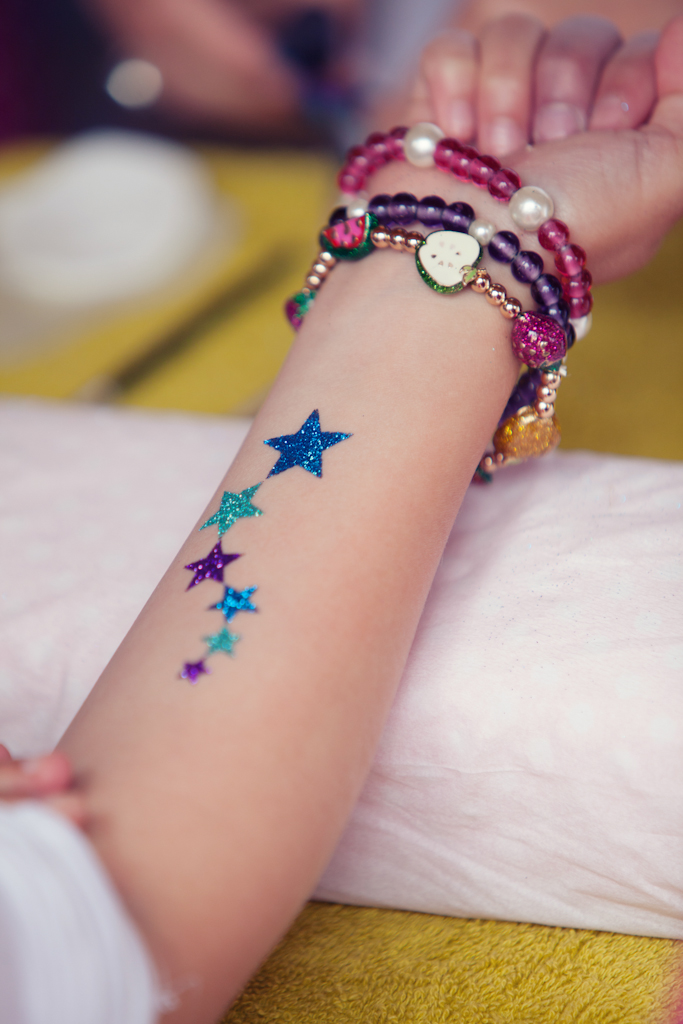 Glitter Six Stars Tattoo On Forearm