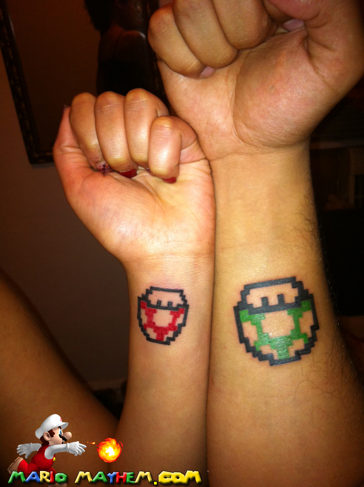 Green And Red Mario Mushroom Tattoos on Couple Wrist