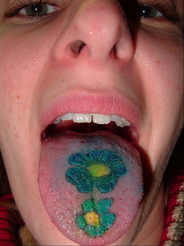 Green And Yellow Two Flowers Tattoo On Tongue