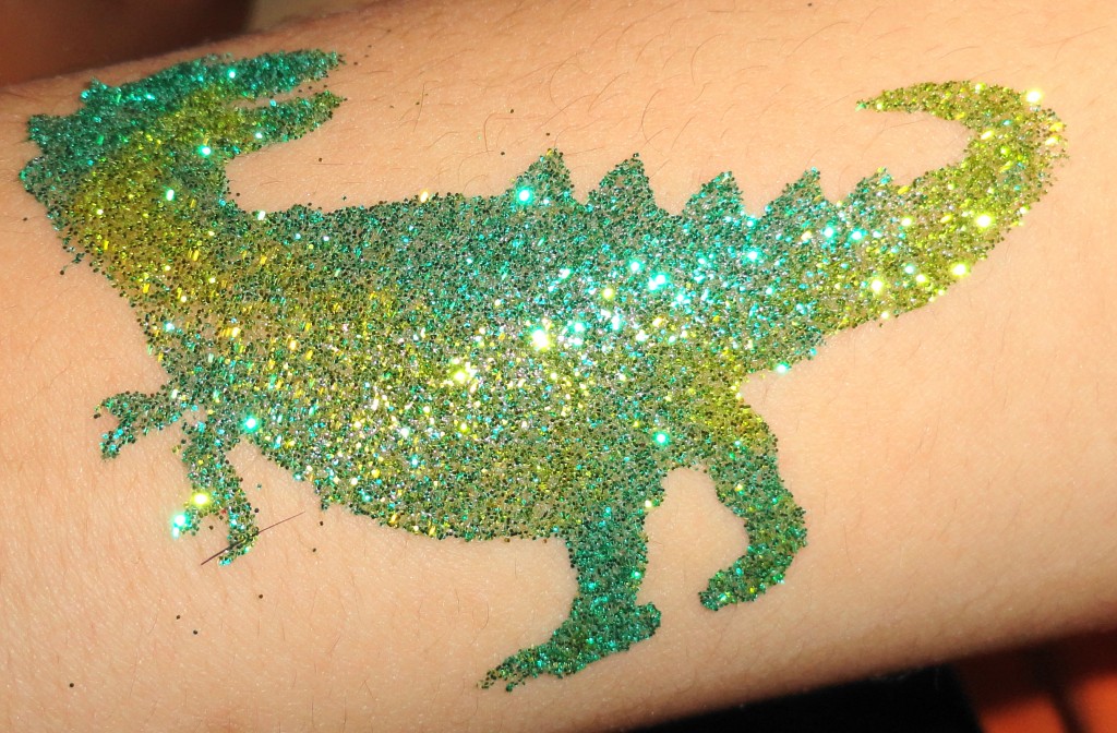 Green Ink Glitter Dinosaur Tattoo Design By Wiggy