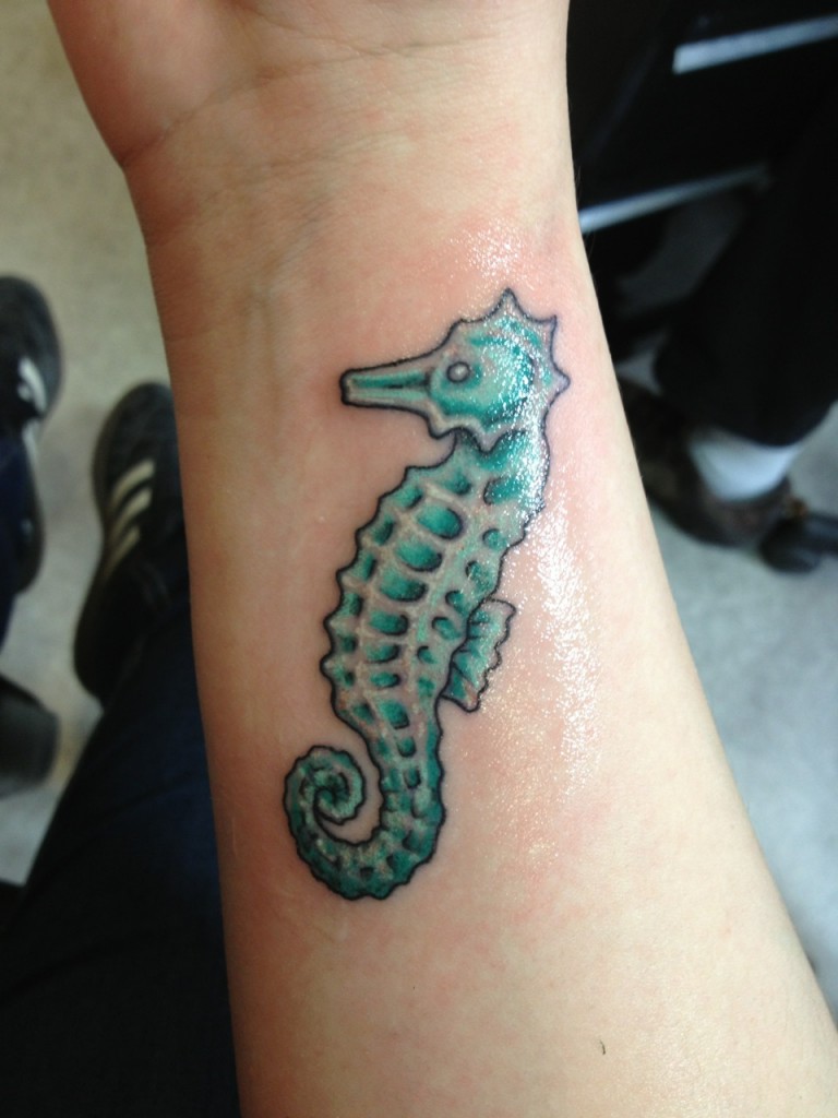 Green Ink Seahorse Tattoo On Wrist