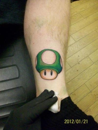 Green Mario Mushroom Tattoo On Leg