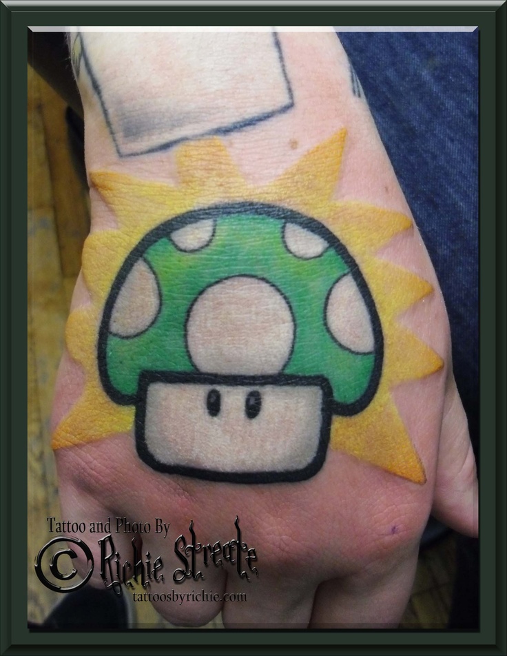 Green Mario Mushroom Tattoo On Right Hand