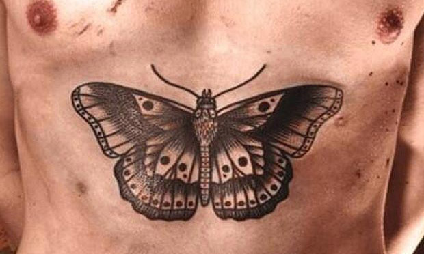 Grey Moth Chest Tattoo Idea