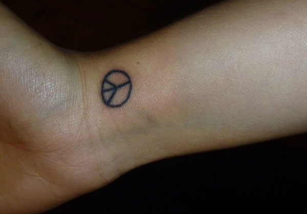 Little Black Peace Logo Tattoo Design For Wrist