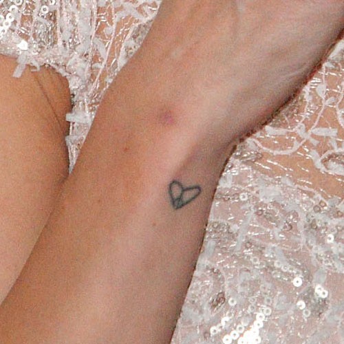 Little Heart Shape Peace Logo Tattoo On Side Wrist