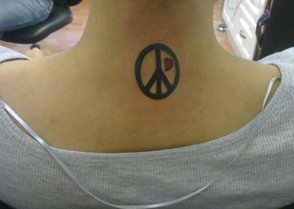 Little Red Heart In Peace Logo Tattoo On Back Neck