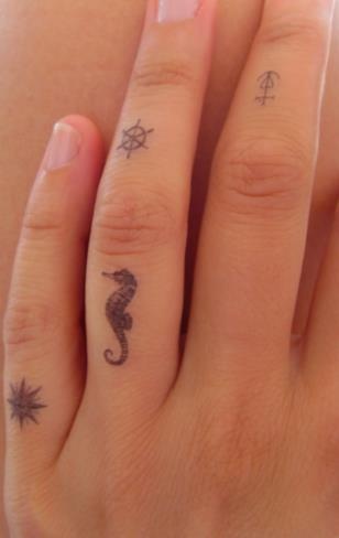 Little Seahorse Tattoo On Finger