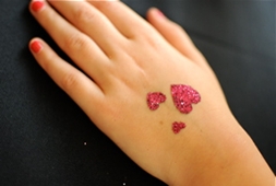 Pink Three Glitter Heart Tattoo On Girl Hand