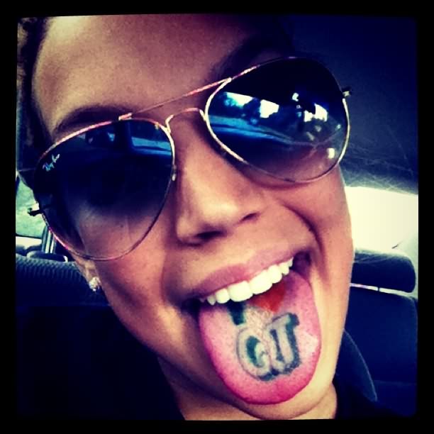 QT Letter Tattoo On Girl Tongue