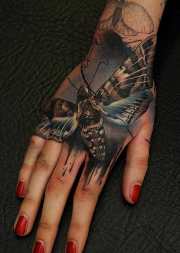 Realistic Moth Tattoo On Girl Right Hand