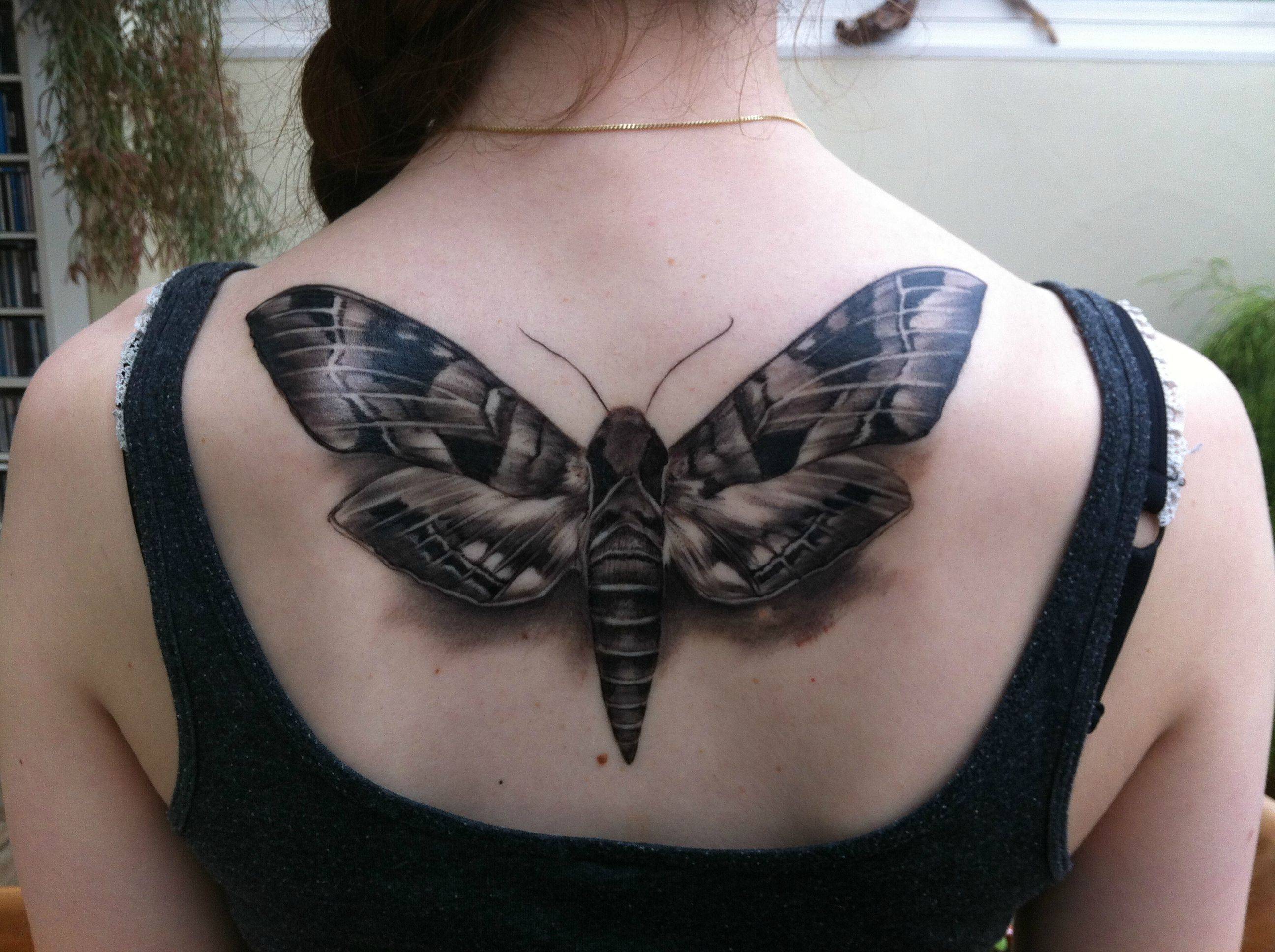 Realistic Moth Tattoo On Girl Upper Back For Girls