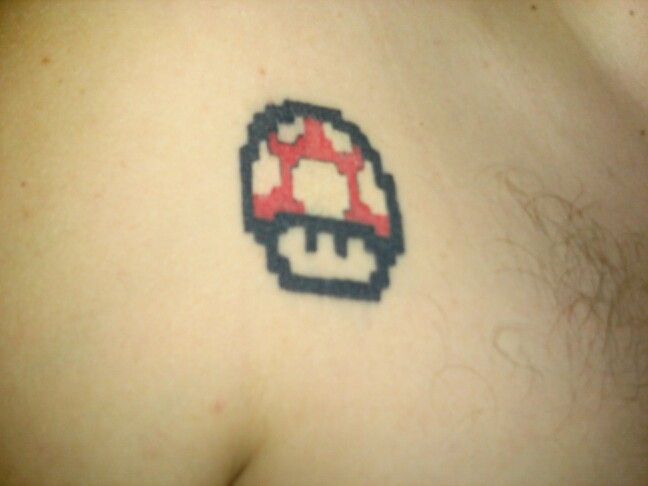 Red Mario Mushroom Tattoo On Front Shoulder