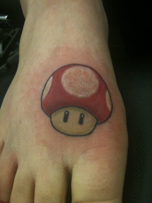 Red Mario Mushroom Tattoo On Right Foot