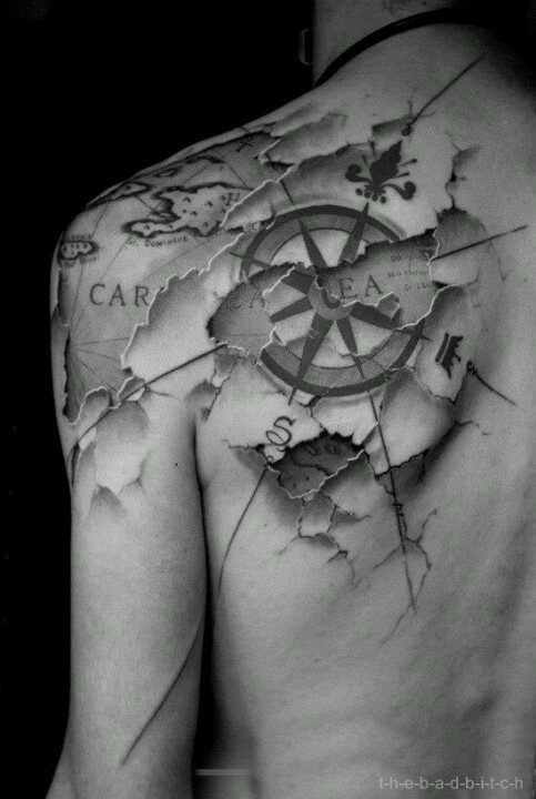 Ripped Skin Map With Compass Tattoo On Left Back Shoulder