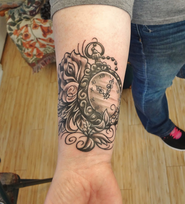 Rose And Clock Tattoo On Side Wrist
